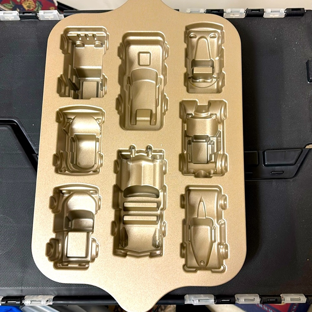 Practically new  Nordic Ware baking mold of eight mini car shapes.